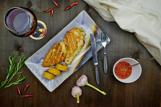 chicken in batter and corn with pomegranate juice