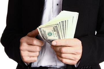 Business man holding money on white background