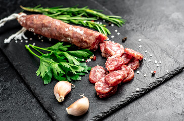 italian sausage with mold on a stone background 