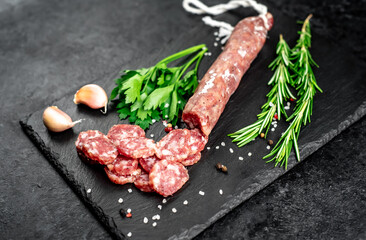 italian sausage with mold on a stone background 