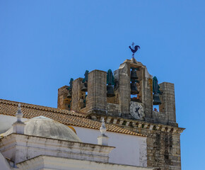 Fototapeta na wymiar Church Bells with rooster weather vane in Tavira, Portugal. 