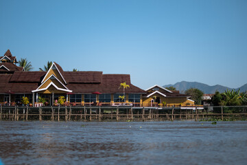 A big yellow house on the riverside in Inle Lake, Myanmar