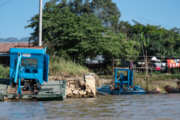 Fototapeta na wymiar Heavy machinery at the riverside in Inle Lake, Myanmar