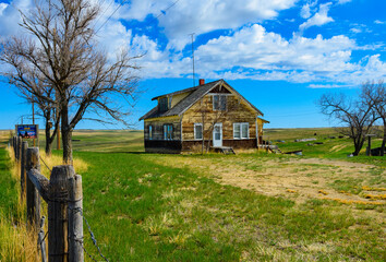 An abandoned  farm house along the highway here in Montana.
