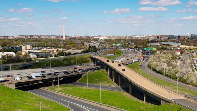 Washington DC city skyline with highway bridge and traffic