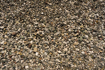 Sea stones background made of a closeup of a pile of pebbles.Relaxing pebbles background for nature pattern concept