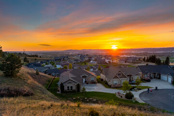 Fototapeta na wymiar Sunset view from a mountain trail overlooking the cities of Spokane, Liberty Lake, Spokane Valley, Greenacres and Otis Orchards, Washington.