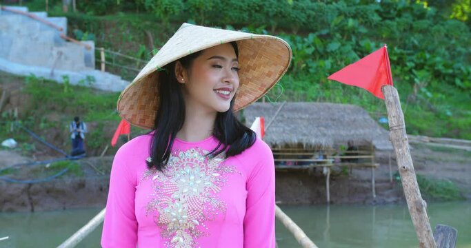 Girl In National Costume Of Vietnam Walking On Bamboo Bridge
