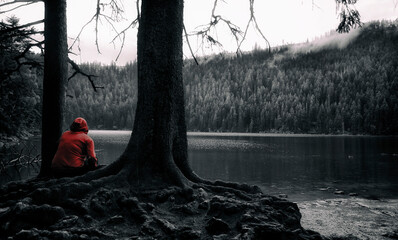 Girl with red clothing near the lake