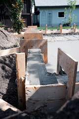concrete drying in wooden forms garage pad 