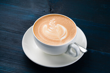 Cup of art latte or cappuccino coffee