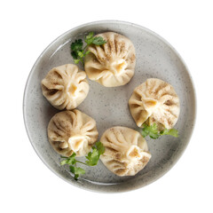 Isolated plate of georgian khinkali dumplings on white