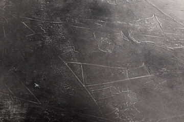 black textured background with white scuffs