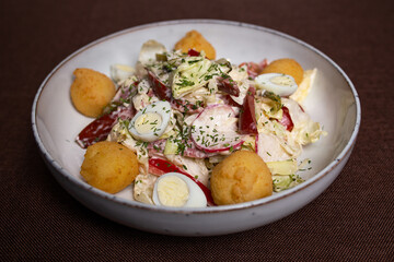 vegetable salad and eggs with cheese balls clouse-up