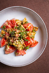 salad with tomatoes and walnuts in sauce