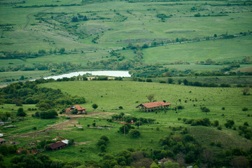 A mountain village in spring, lush green fields and trees