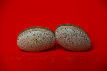 vitamin for human health close upon a red background