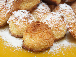 Coconut cookies on a yellow plate. Handmade.
