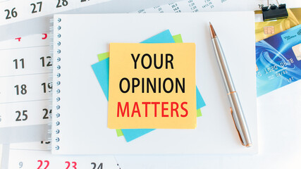 your opinion matters, the text is written on yellow paper lying on a white notepad on the desktop of an office employee, concept