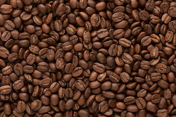 Roasted coffee beans background. Close up top view.