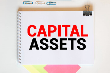text Capital Assets on a Notepad. Money to Finance a business.