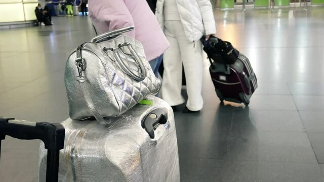 Passengers people and suitcases hand luggage bags at the airport at the train station