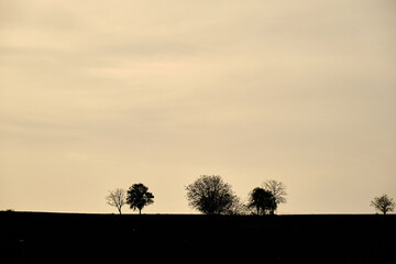 Sunset sky and small hill. Silhouette of hill and trees on the sky in bursa turkey.