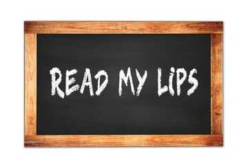 READ  MY  LIPS text written on wooden frame school blackboard.