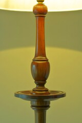 dim lighting room of the mahogany antique lamp. 

This expensive furniture is made in England. 
blurred background soft focus image.	