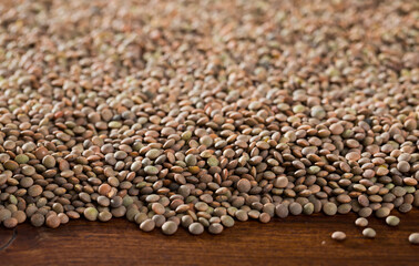 Obraz premium Image of raw lentil background on wooden surface, nutritious food
