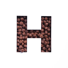 Letter H of alphabet made of bio chocolate cereal balls and paper cut isolated on white. Typeface for healthy food store