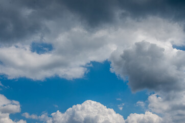 Obraz premium View into impressive spring sky with thick clouds as a texture or background