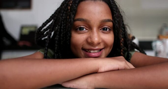 Happy teen girl authentic smile. Close-up portrait face closeup child, african descent ethnicity