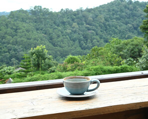 An empty coffee cup on a wooden background
