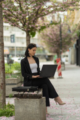 Businesswoman is working outside