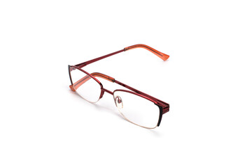 Reading glasses on a white surface.