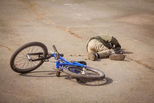 The Child Fell Off The Bike. The Incident On The Road With The Child. Bicycle Accident