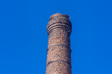 Old brick chimney. Antique brick chimney at the factory