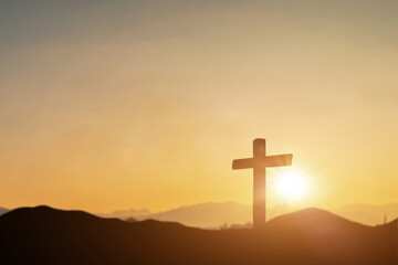 Crucifixion of jesus christ, catholic cross at sunset background. Resurrection concept