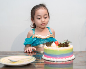 Little girl celebrating her birthday at home during quarantine. Wearing arabian princess costume.