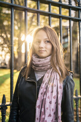 Portrait of a beautiful young woman outdoors in the city. Urban landscape. Travel and freelance lifestyle. Youth and beauty