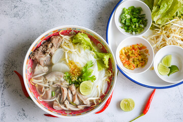 Noodle soup bowl, Thai rice vermicelli noodle with spicy soup and fresh vegetable set with lemon sprouts bean pepper chili sauce Thai traditional menu food