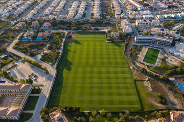 Aerial view over city of Lagos in Algarve, Portugal. Football training. Southern golden coast.