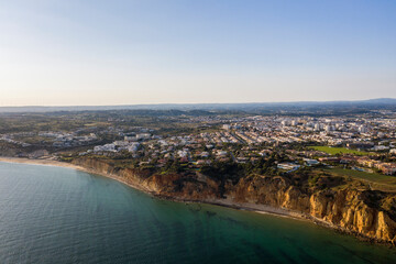 Canavial Beach. Portuguese southern golden coast cliffs. Aerial view over city of Lagos in Algarve,...