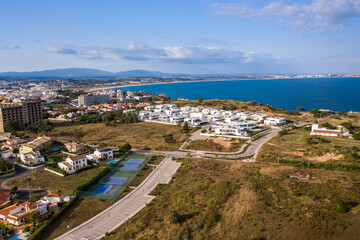 Fototapeta na wymiar Canavial Beach. Portuguese southern golden coast cliffs. Aerial view over city of Lagos in Algarve, Portugal.