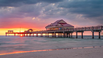 Beautiful seascape with sunset. Fishing pier. Summer vacations. Clearwater Beach Pier 60. Ocean or Gulf of Mexico. Florida paradise. Tropical nature. Good for travel agency.