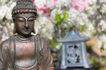 Buddha Statue in Outdoor Garden With Blurred Background