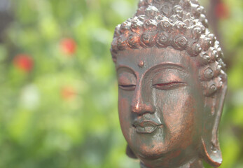 Buddha Statue in Outdoor Garden With Blurred Background