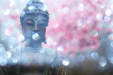 Buddha Statue in Outdoor Garden With Blurred Background
