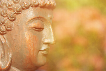 Buddha Statue in Outdoor Garden With Blurred Background